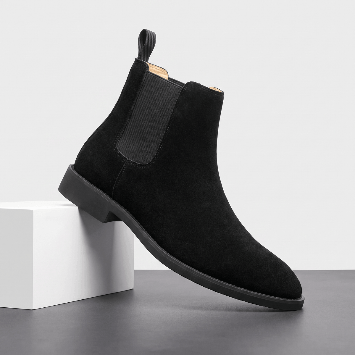 Single black vegan suede Chelsea boot with elastic side panel, rear pull tab and block heel.