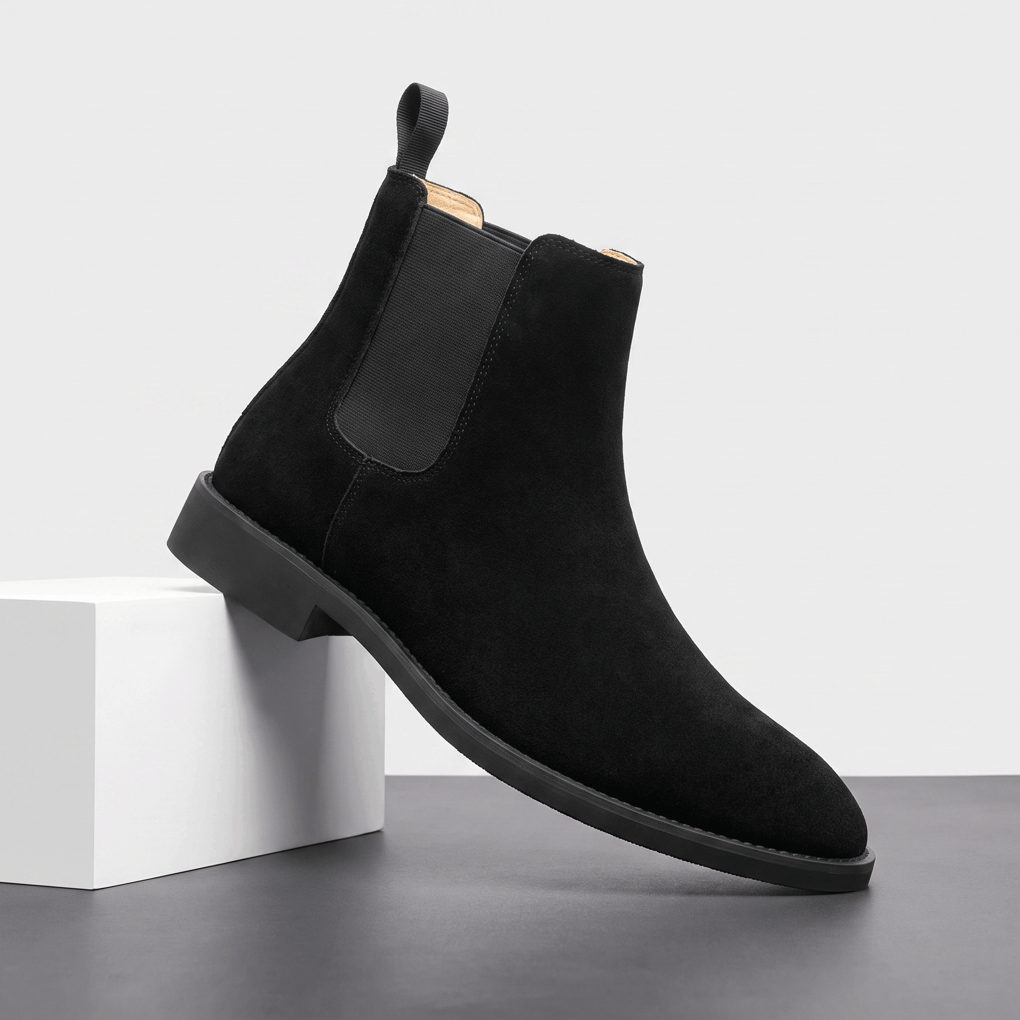 Single black vegan suede Chelsea boot with elastic side panel, rear pull tab and block heel.
