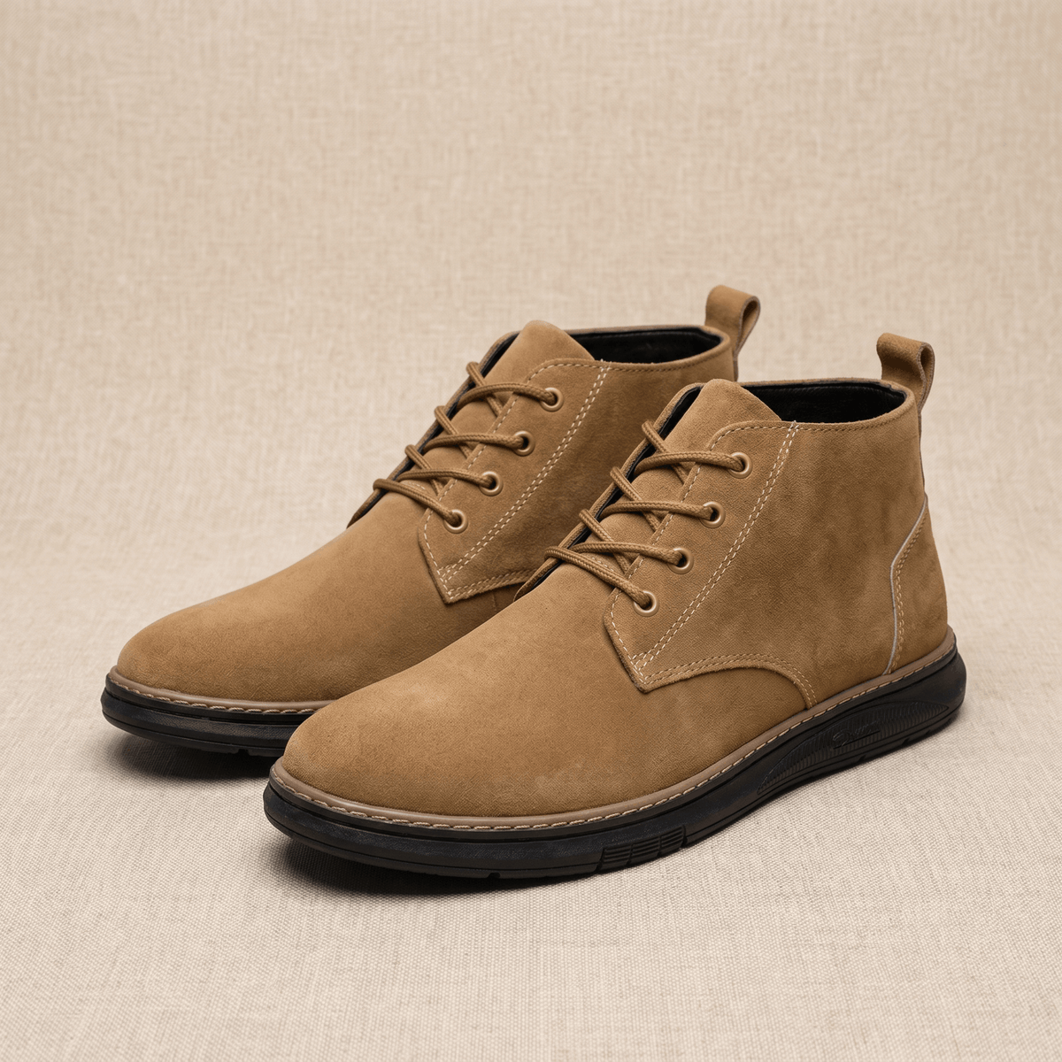 Pair of camel vegan suede lace-up chukka boots displayed on a neutral background.