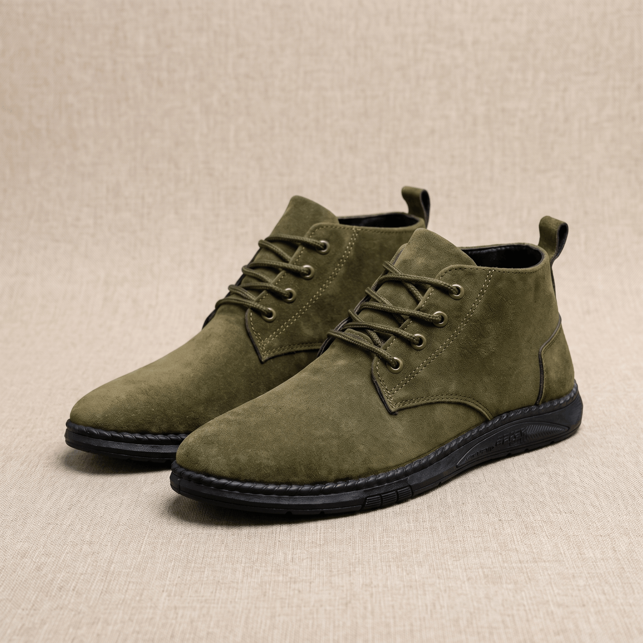 Olive green vegan suede lace-up chukka boots displayed on a neutral background.