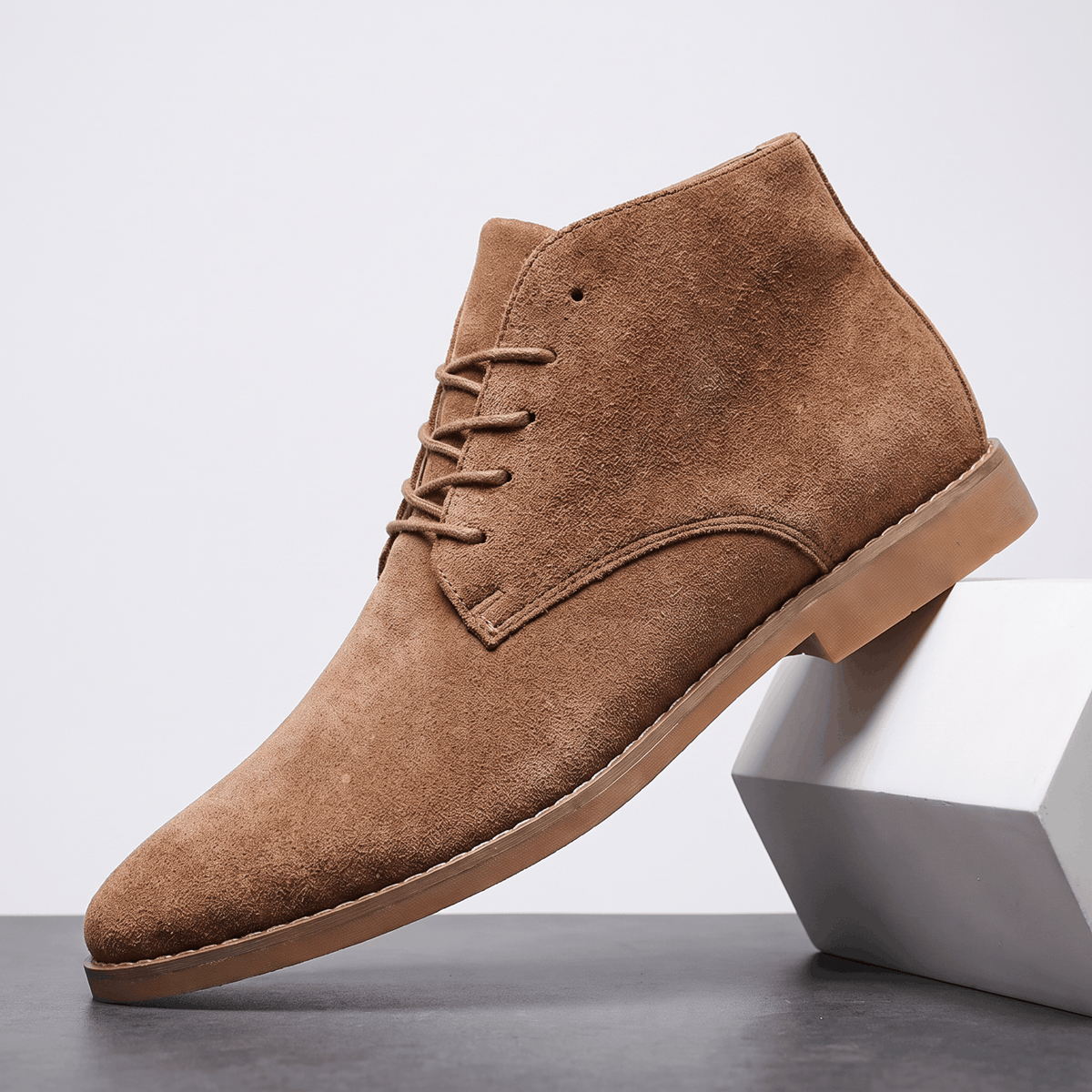 Khaki vegan suede lace-up desert boot displayed on a white pedestal.