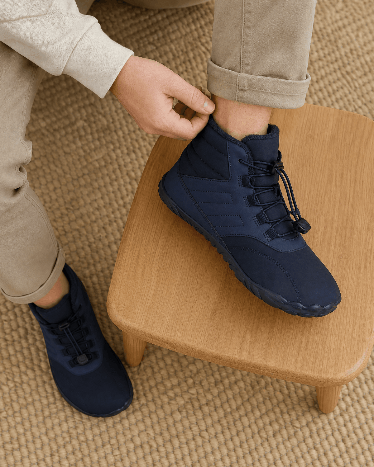 Blue water-repellent winter ankle boots with fleece-lined collars, bungee lace toggles, and flexible rubber soles.
