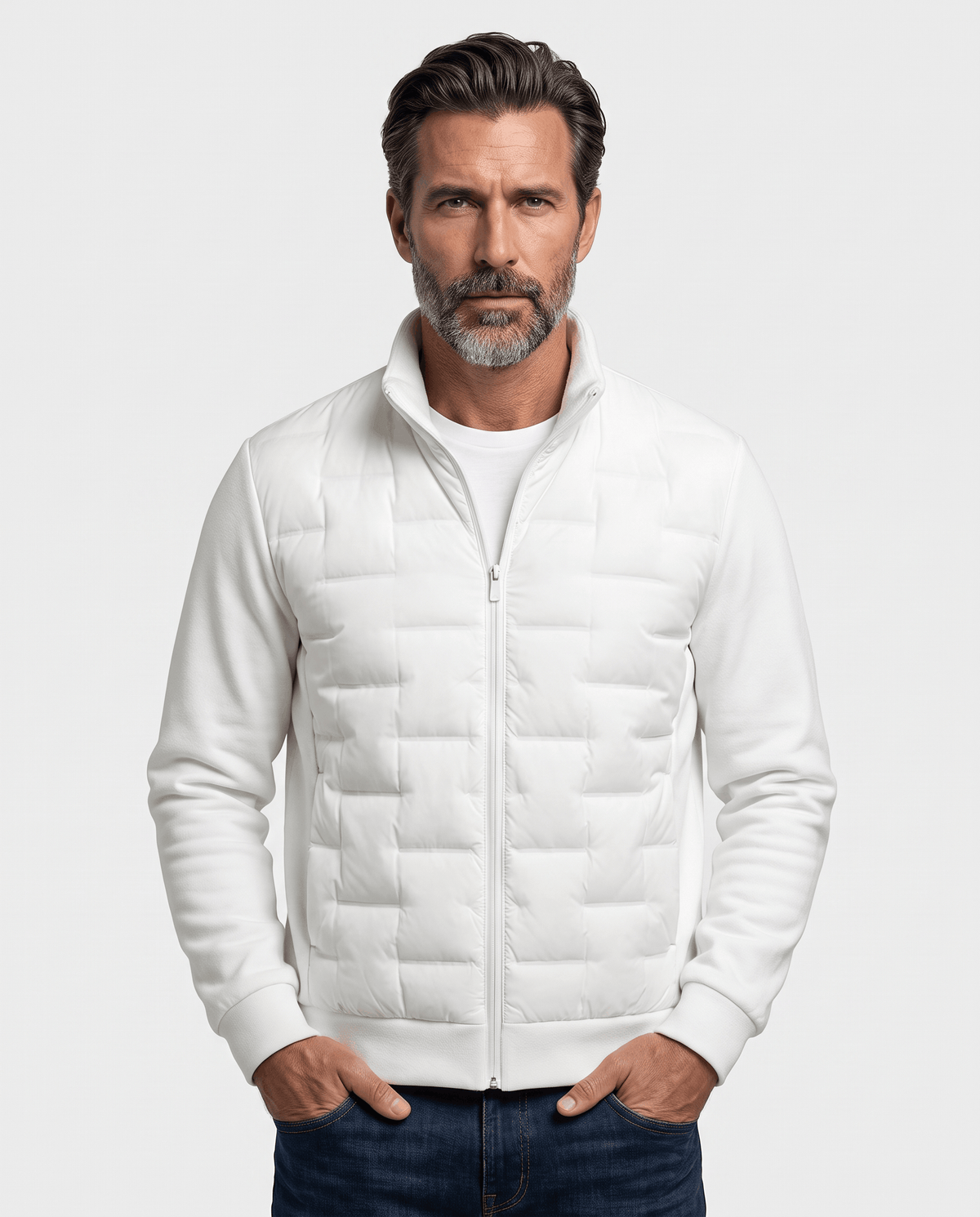 Man wearing a white hybrid puffer jacket with quilted body and fleece sleeves, front view