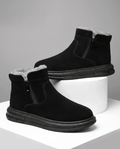 Black wide toe box winter boots for men with side zip and plush fleece lining displayed on white blocks.