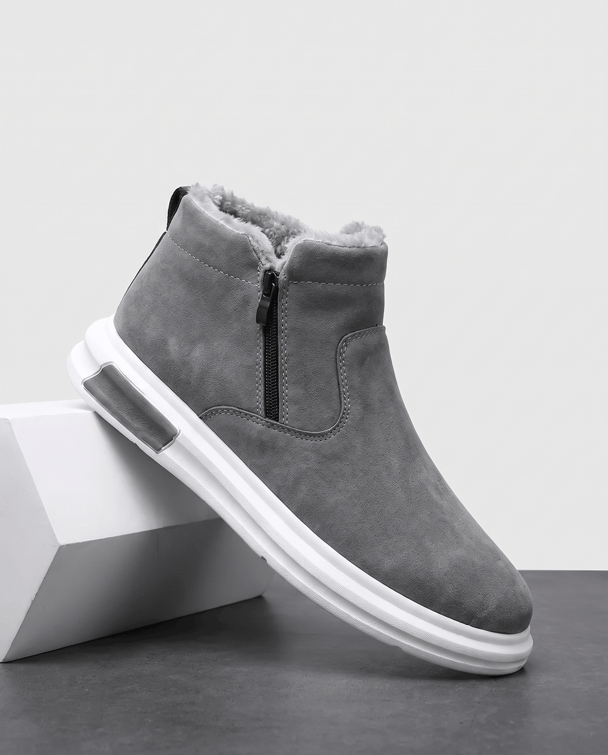 Gray wide toe box winter boots shown from a side angle on a white pedestal.