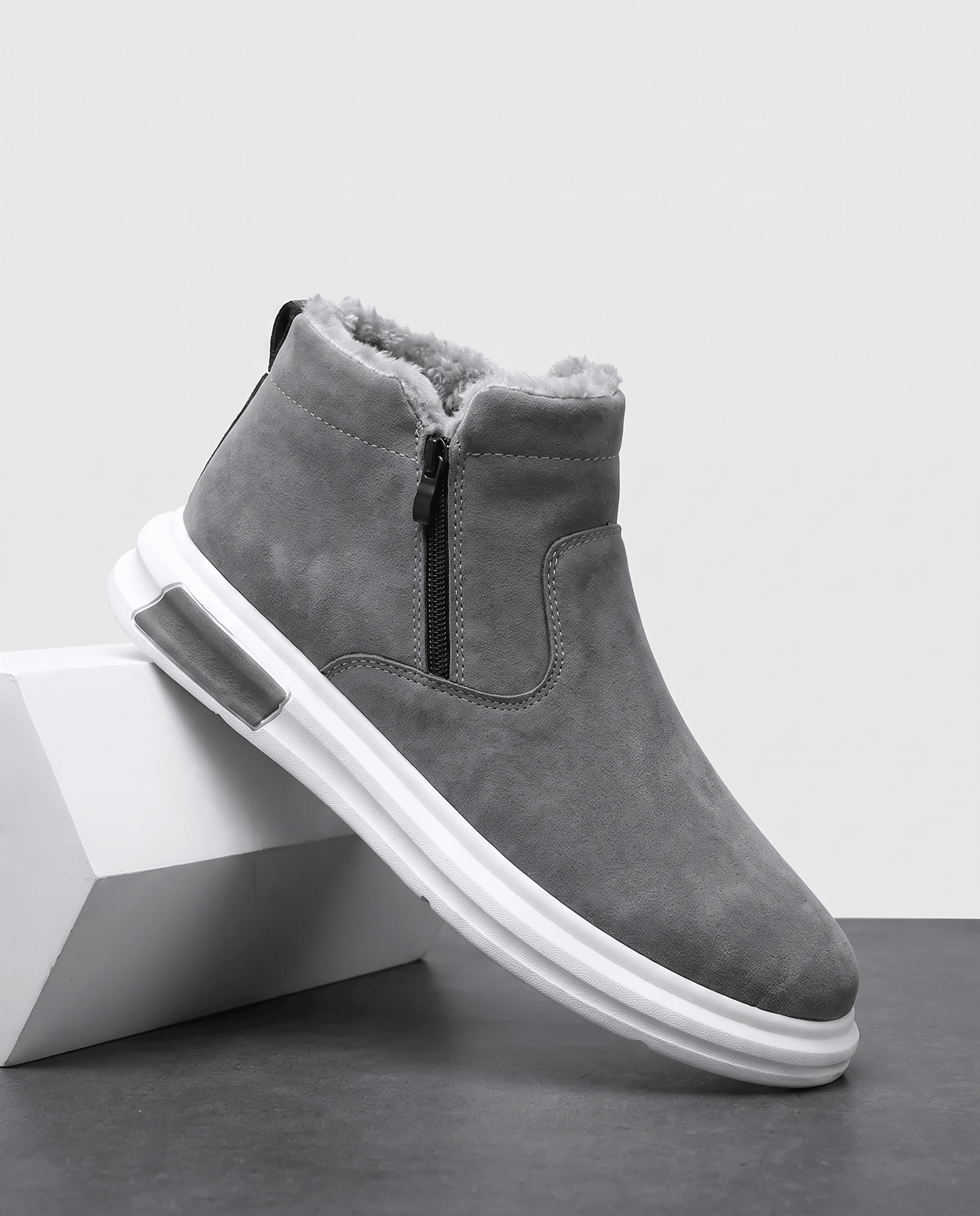 Gray wide toe box winter boots shown from a side angle on a white pedestal.