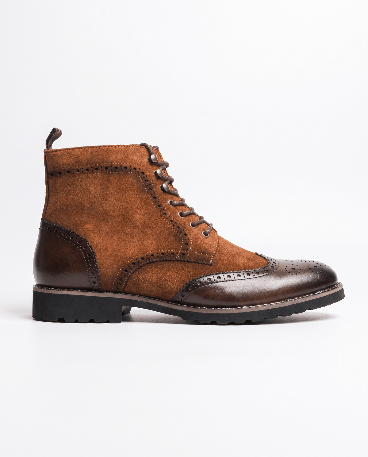Side view of a brown suede ankle boot with a dark brown polished wingtip toe