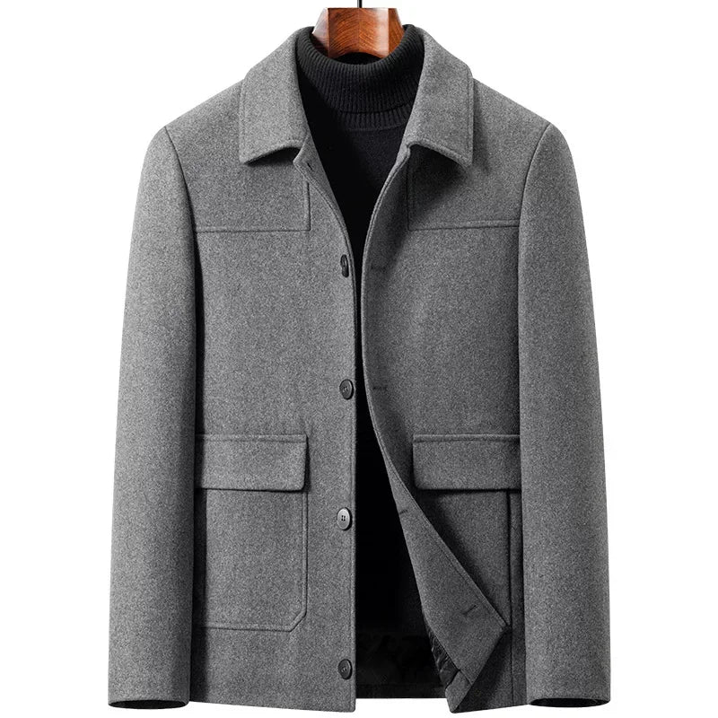Gray coat on a form, front open to show the inner placket and lining