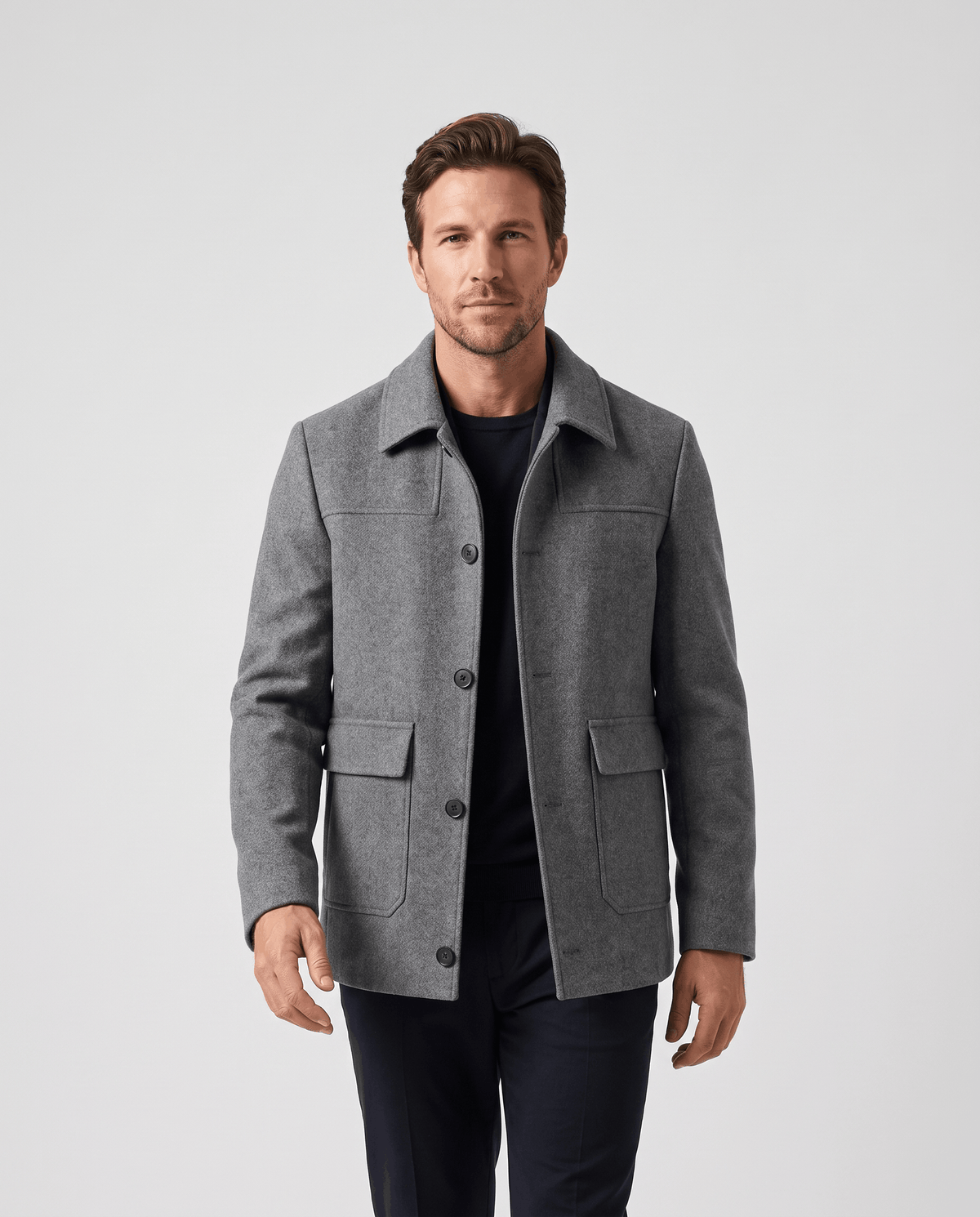 Men's wool-blend car coat in gray, buttoned over a black roll neck