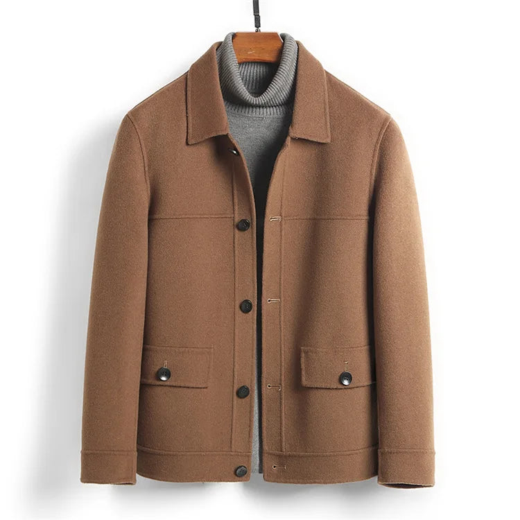 Camel jacket photographed flat on a hanger showing both hip flap pockets
