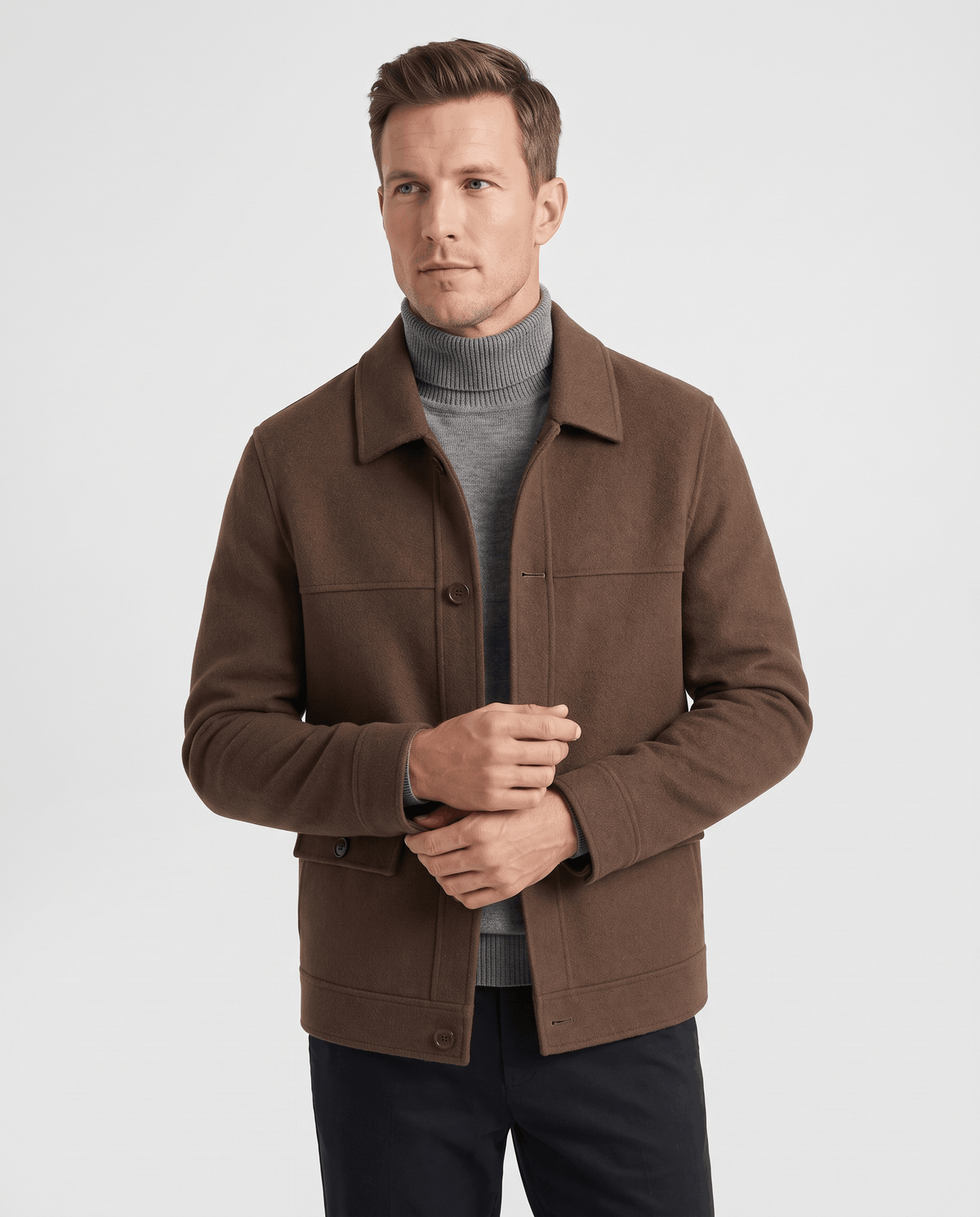 Dark brown chore jacket front view worn open over a gray knit turtleneck
