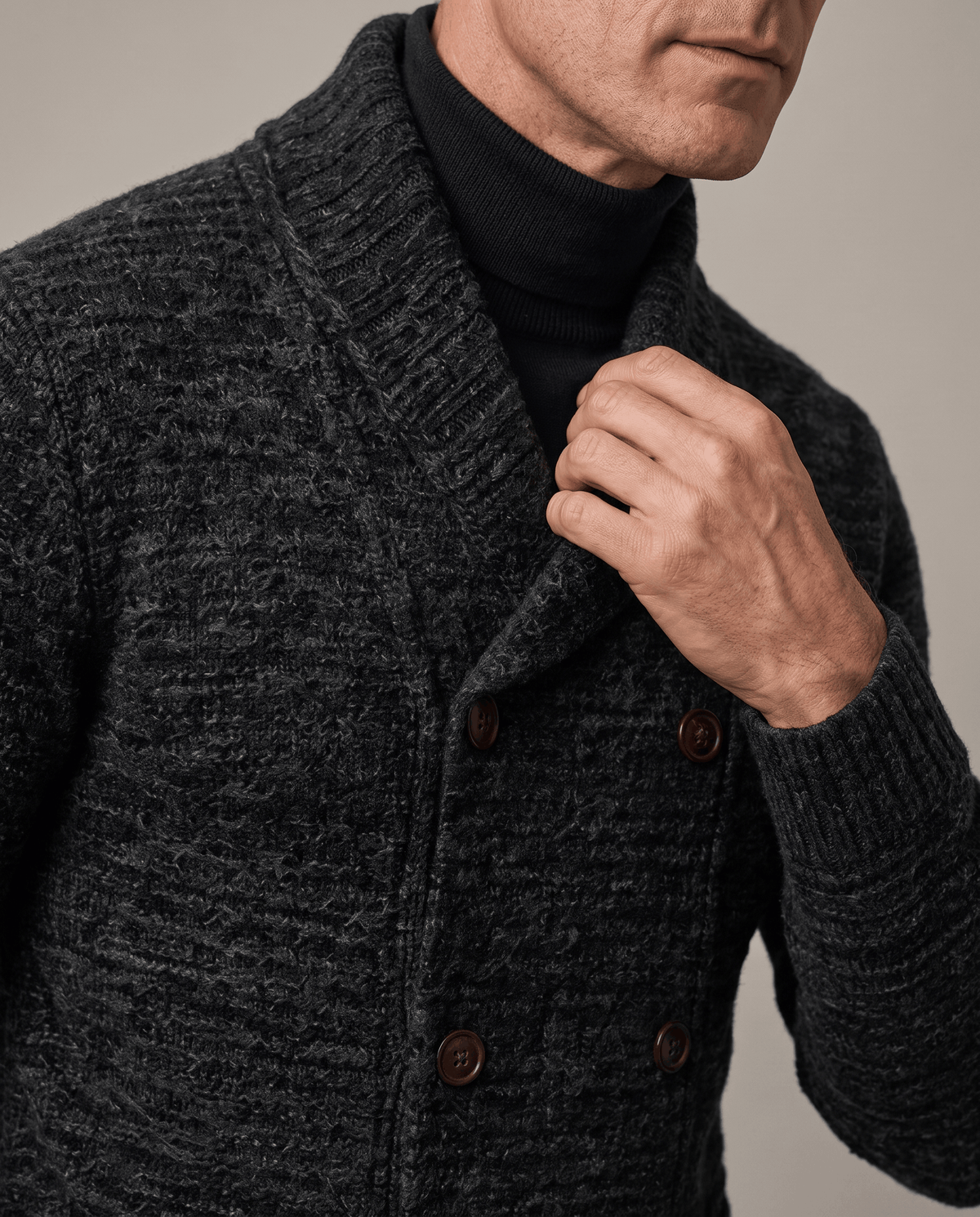 Black cardigan shawl collar and textured knit shown in close view