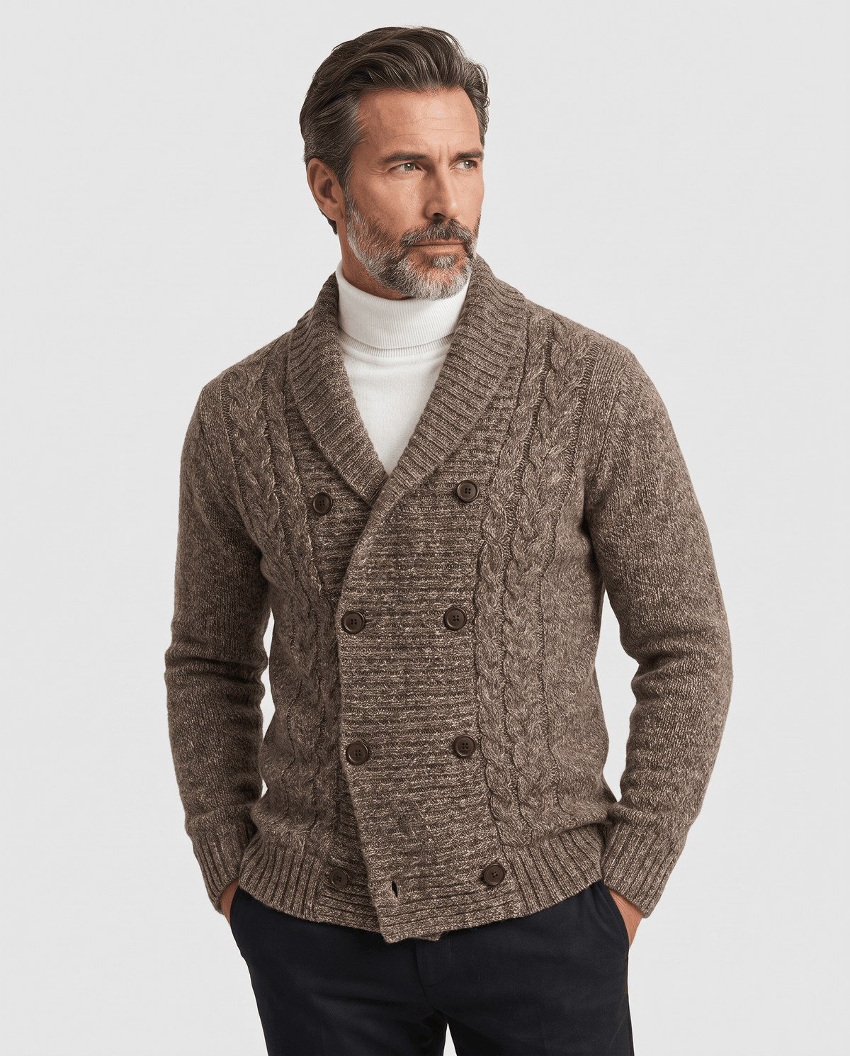 Men's dark brown double-breasted shawl collar cardigan worn over a white turtleneck