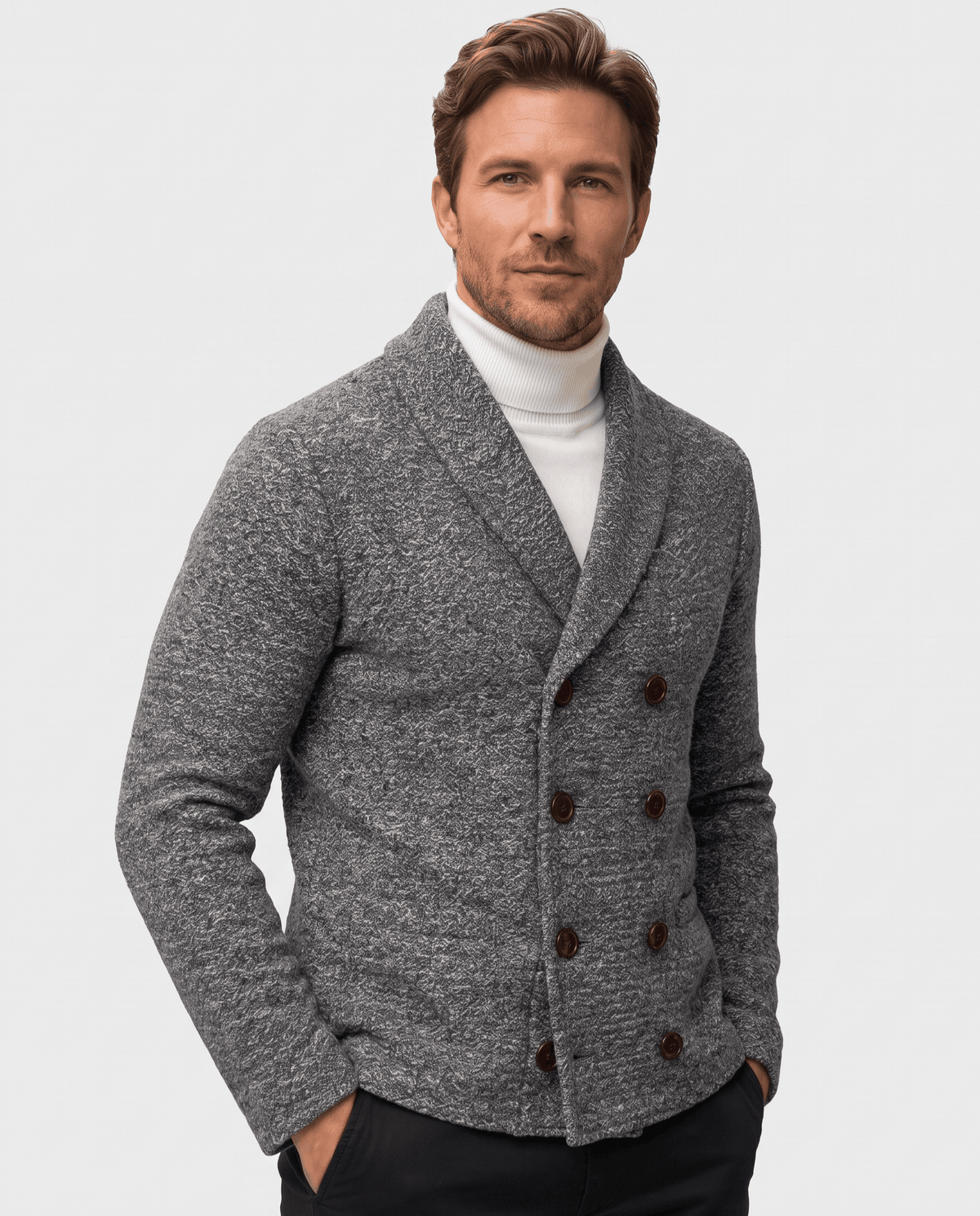 Men's dark gray double-breasted shawl collar cardigan worn over a white turtleneck
