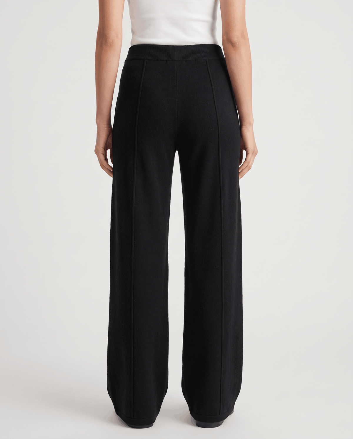 Full back view of black high-waisted wide-leg knit pants