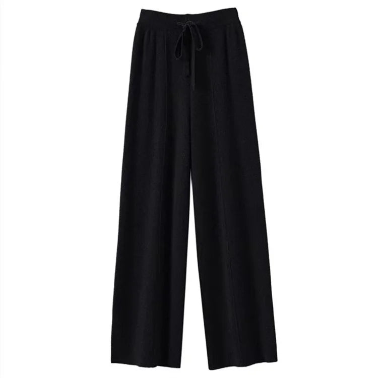 Flat lay of black wide-leg knit pants with drawstring tie