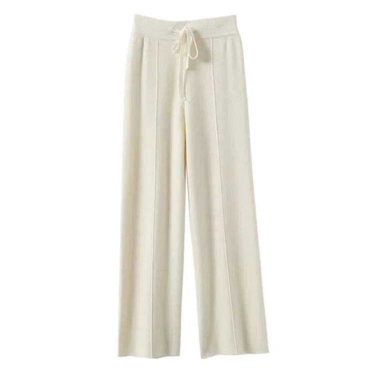 Flat lay of ivory wide-leg knit pants with tie waist