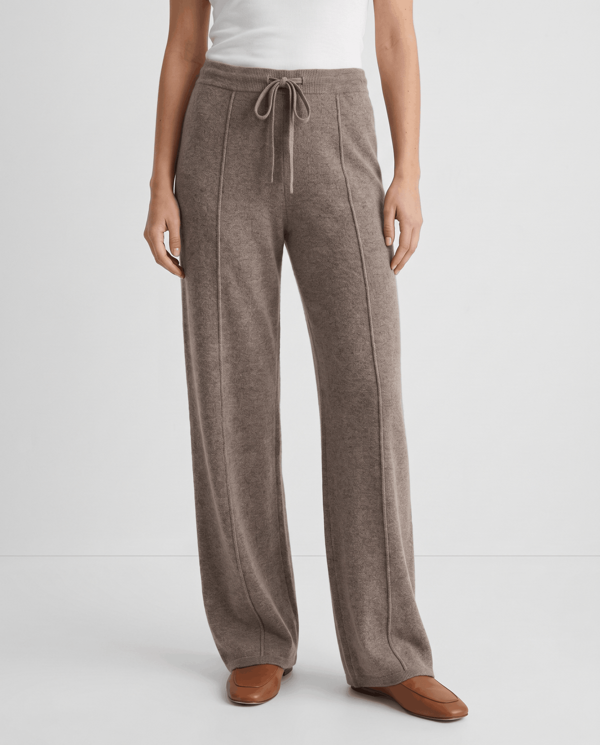 Front view of taupe high-waisted knit pants with drawstring tie