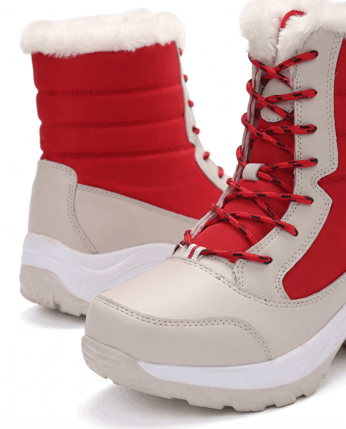 Close view of red lace-up boot with quilted upper, beige toe panel and soft white collar