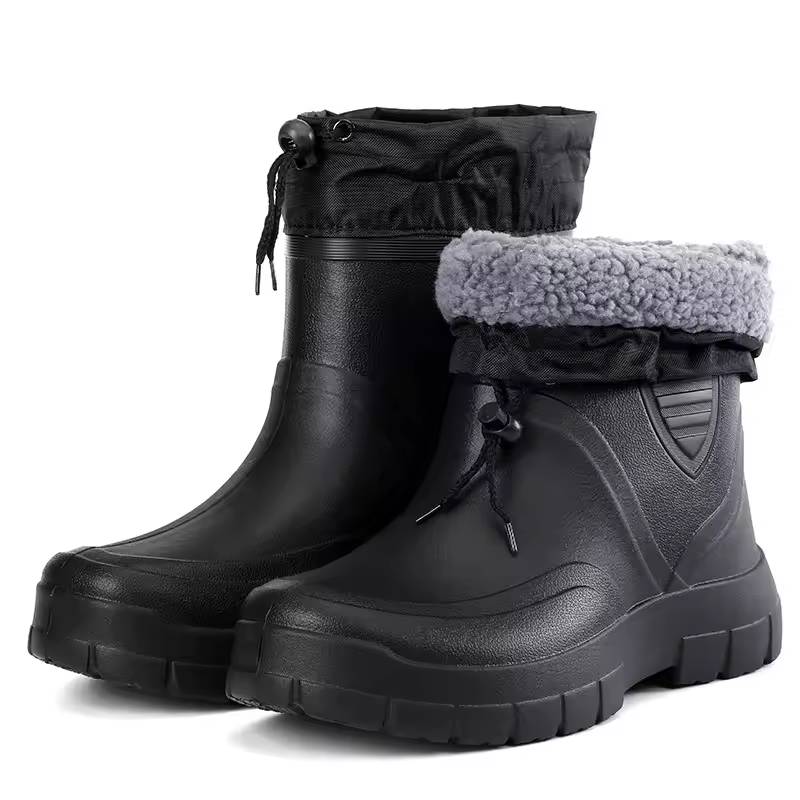 Pair of black boots with soft gray lining showing at the collar opening