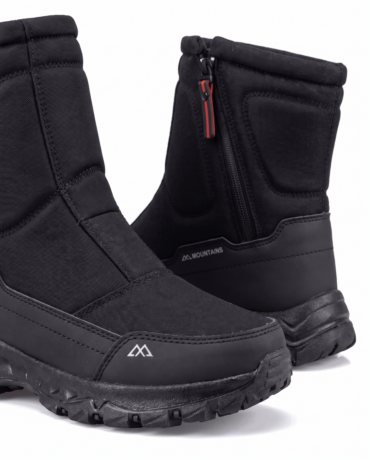 Close view of black boot front zipper, quilted shaft and fleece collar