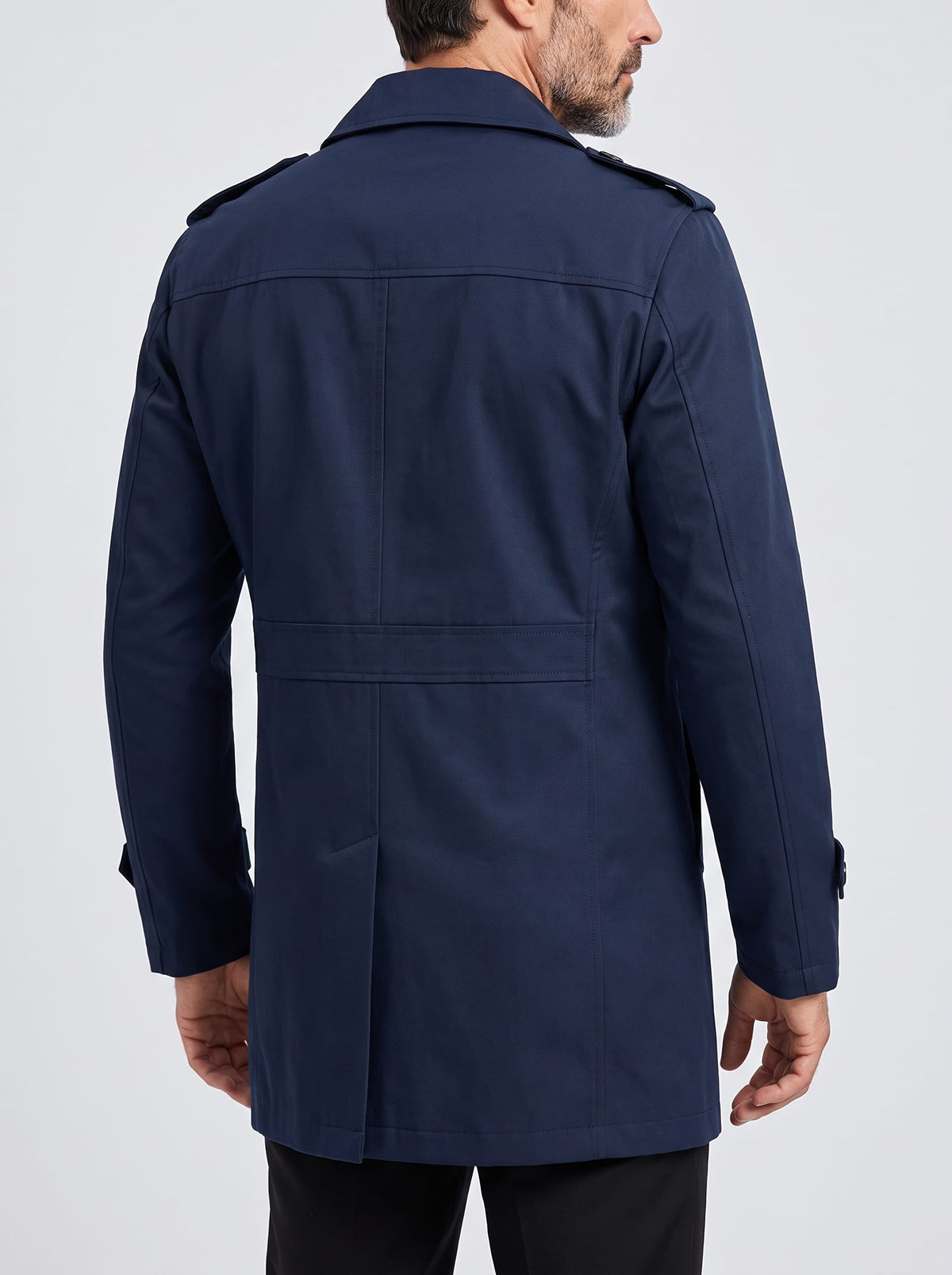 Back view of navy blue trench coat with epaulets and cuff straps
