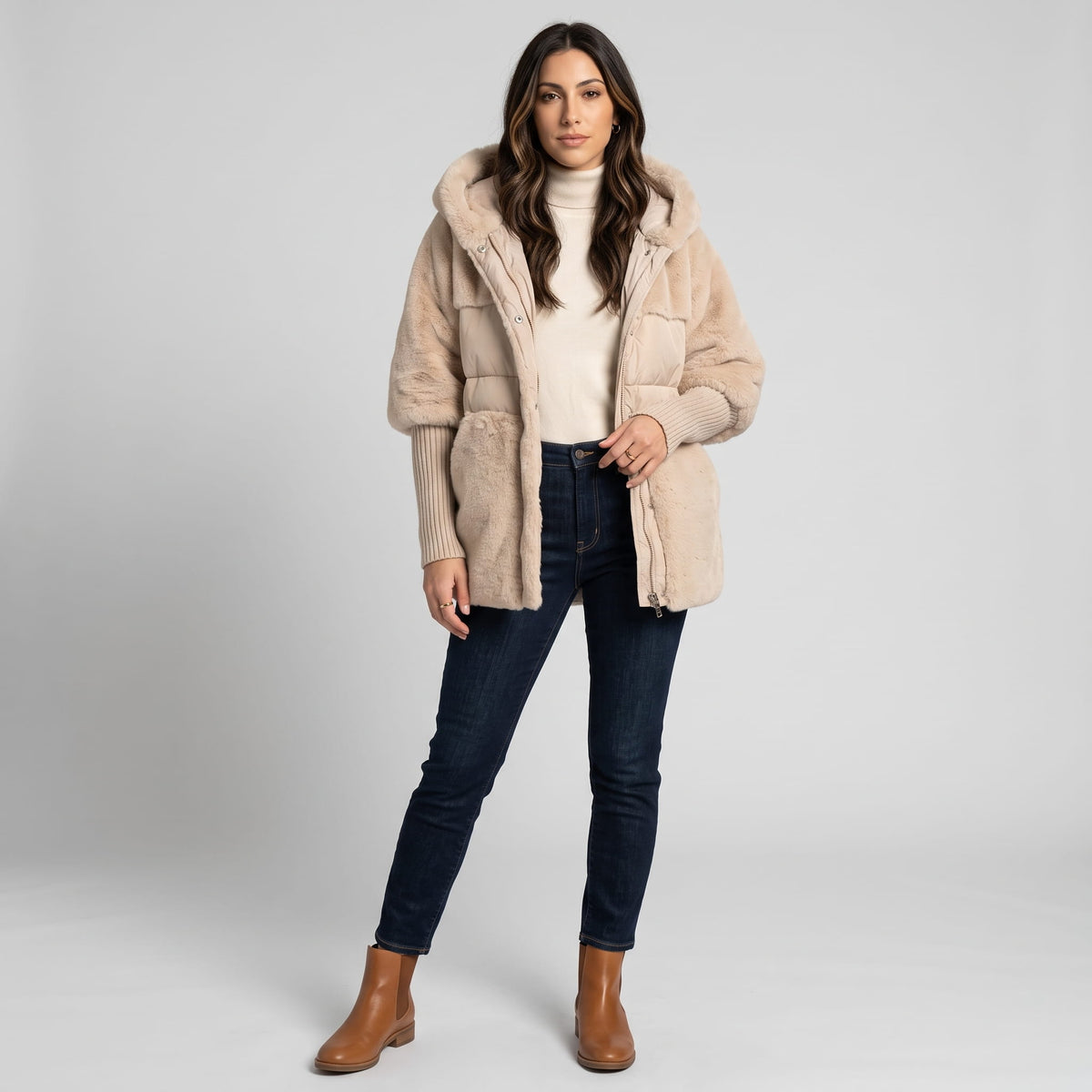 Full-length view of light beige parka with dark jeans and brown boots