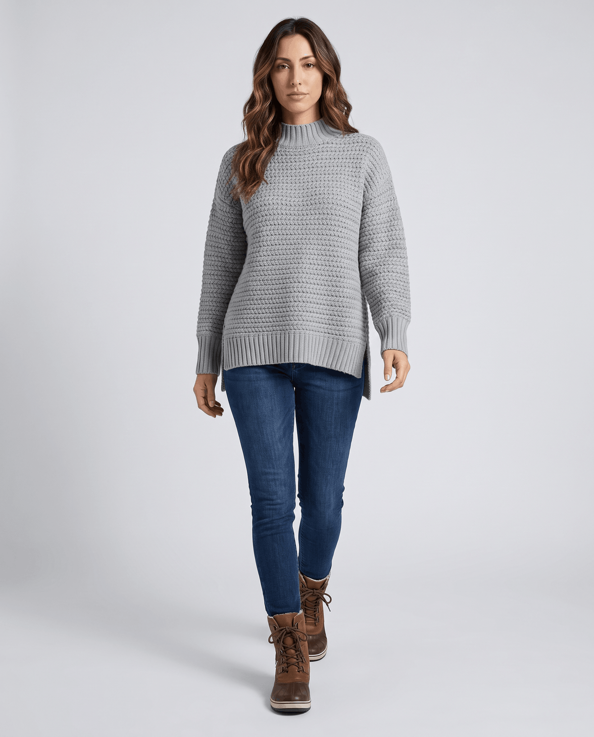 Full-length view of gray mock neck sweater with jeans and brown ankle boots
