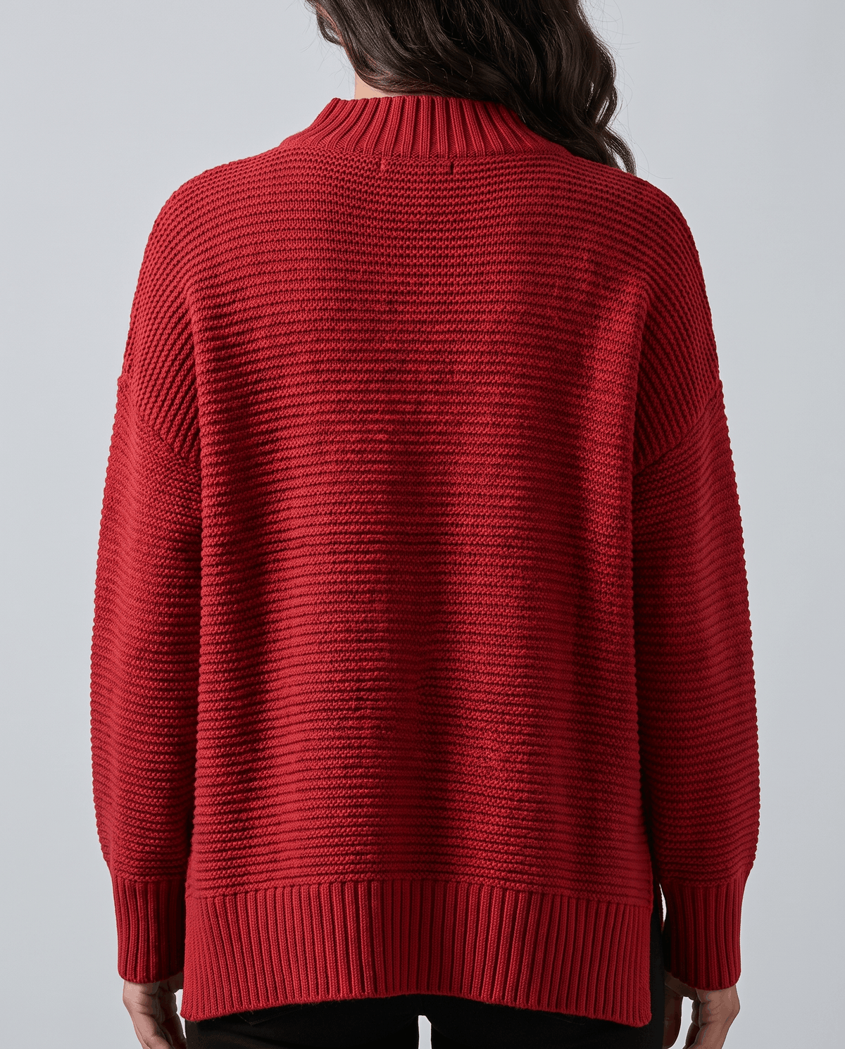 Full back view of red oversized sweater with long ribbed cuffs