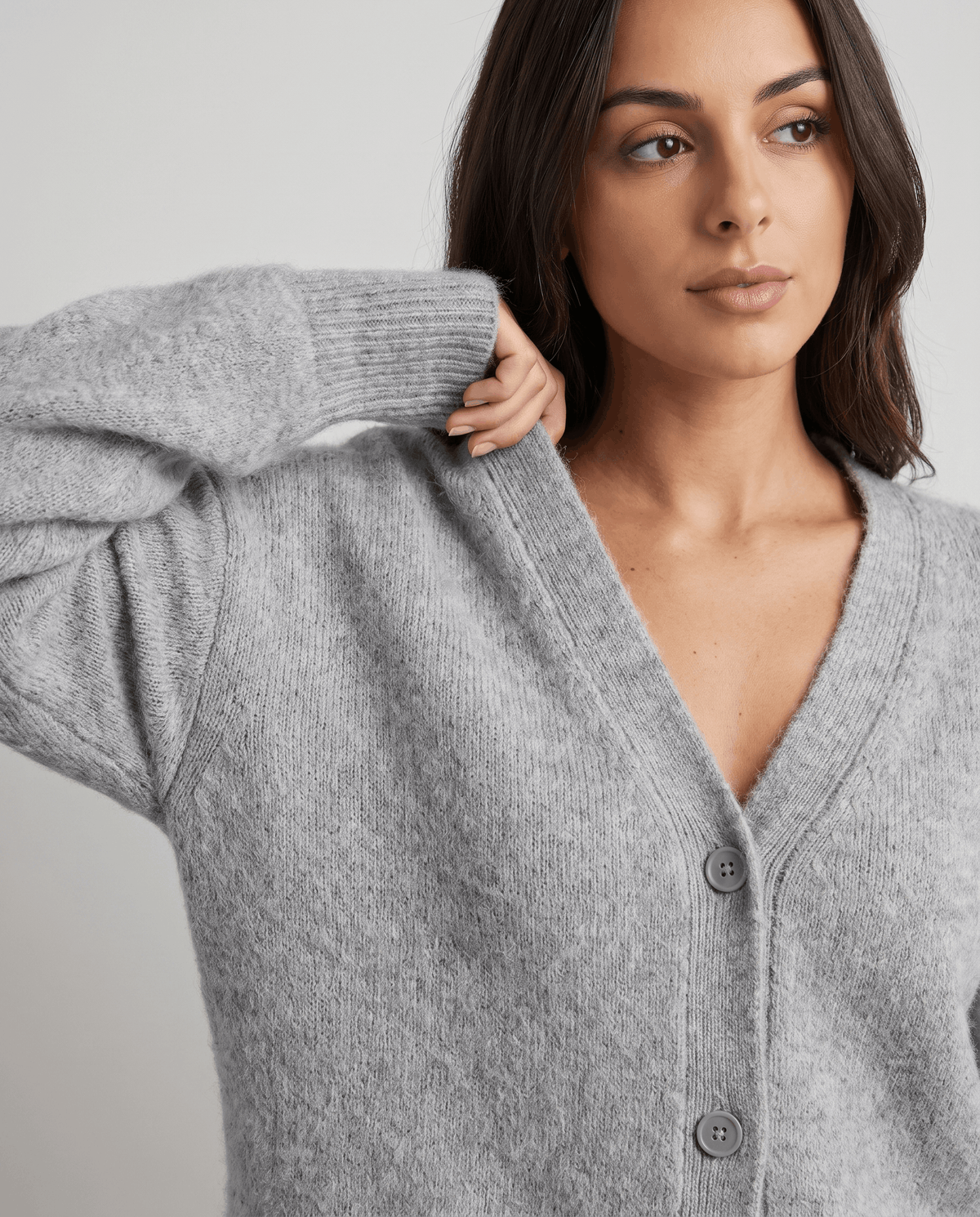 Gray cardigan neckline detail showing the deep V and soft brushed wool-blend texture