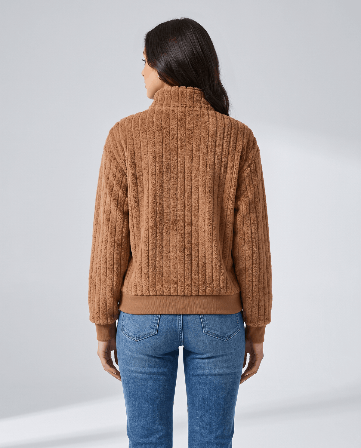 Back view of camel brown pullover showing vertical ribs and long sleeves
