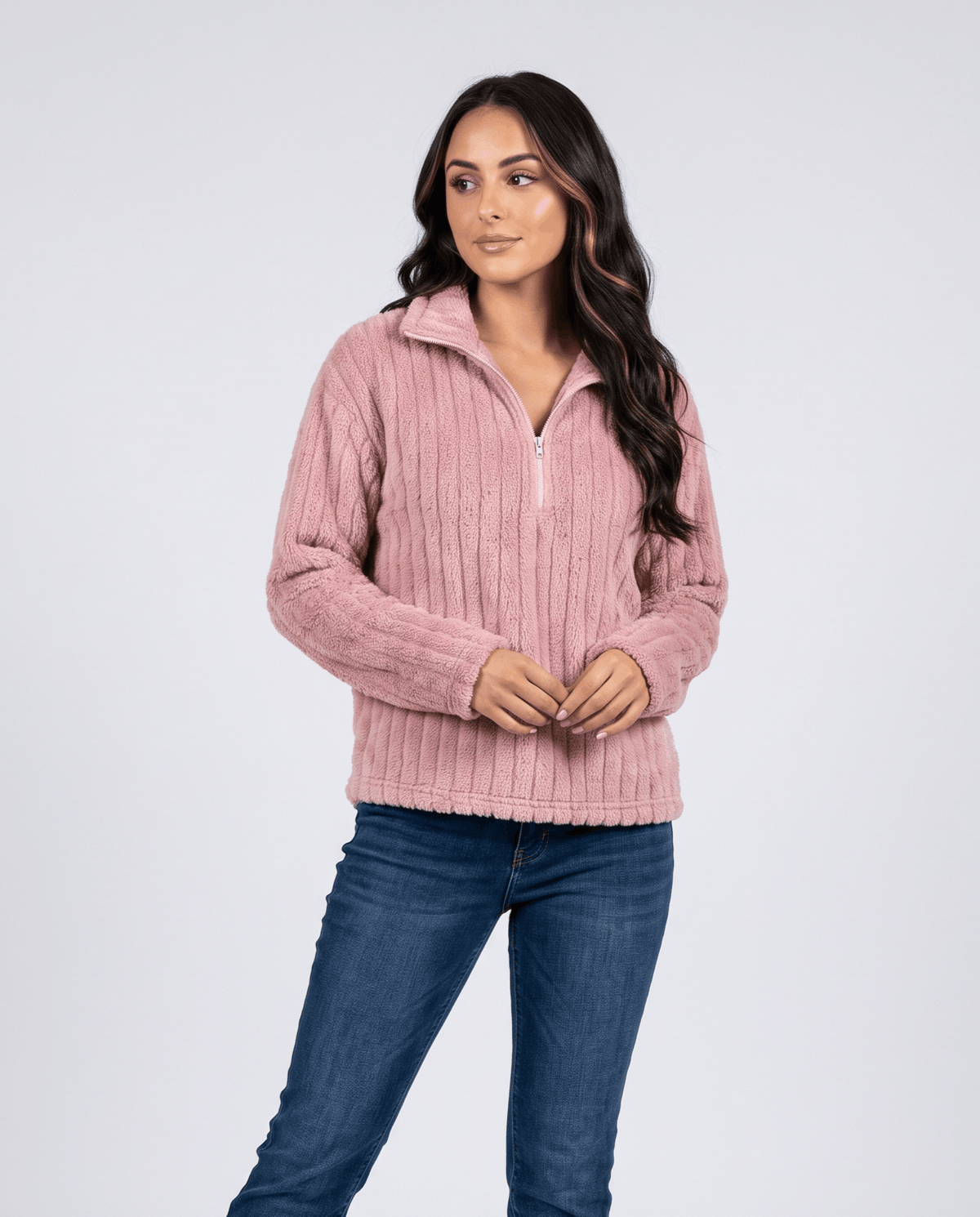 Front view of dusty pink plush pullover styled with light wash jeans