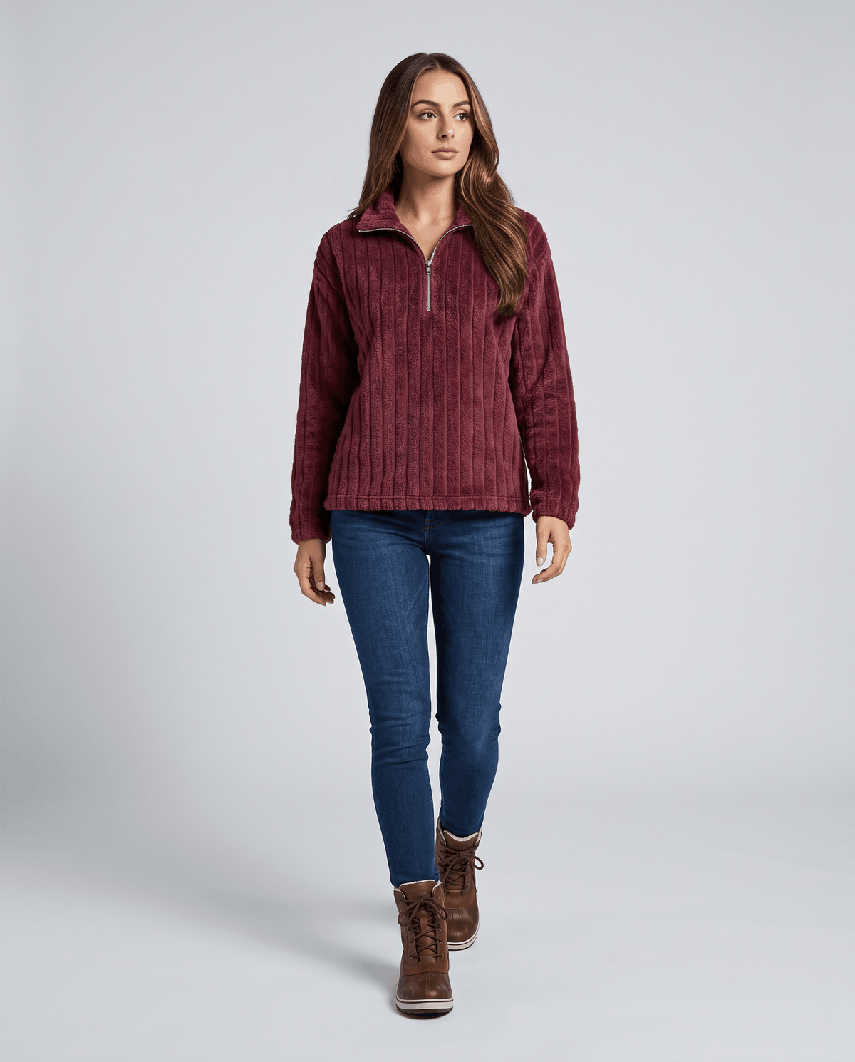 Full-length view of burgundy pullover with jeans and brown ankle boots