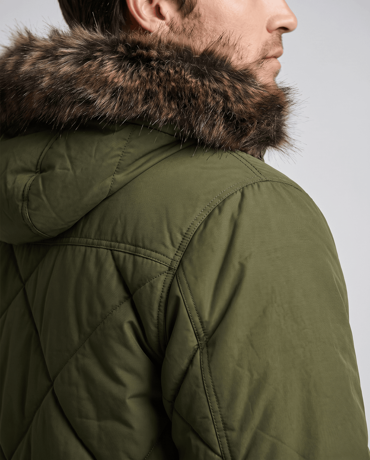 Men's army green quilted long parka, hood side detail