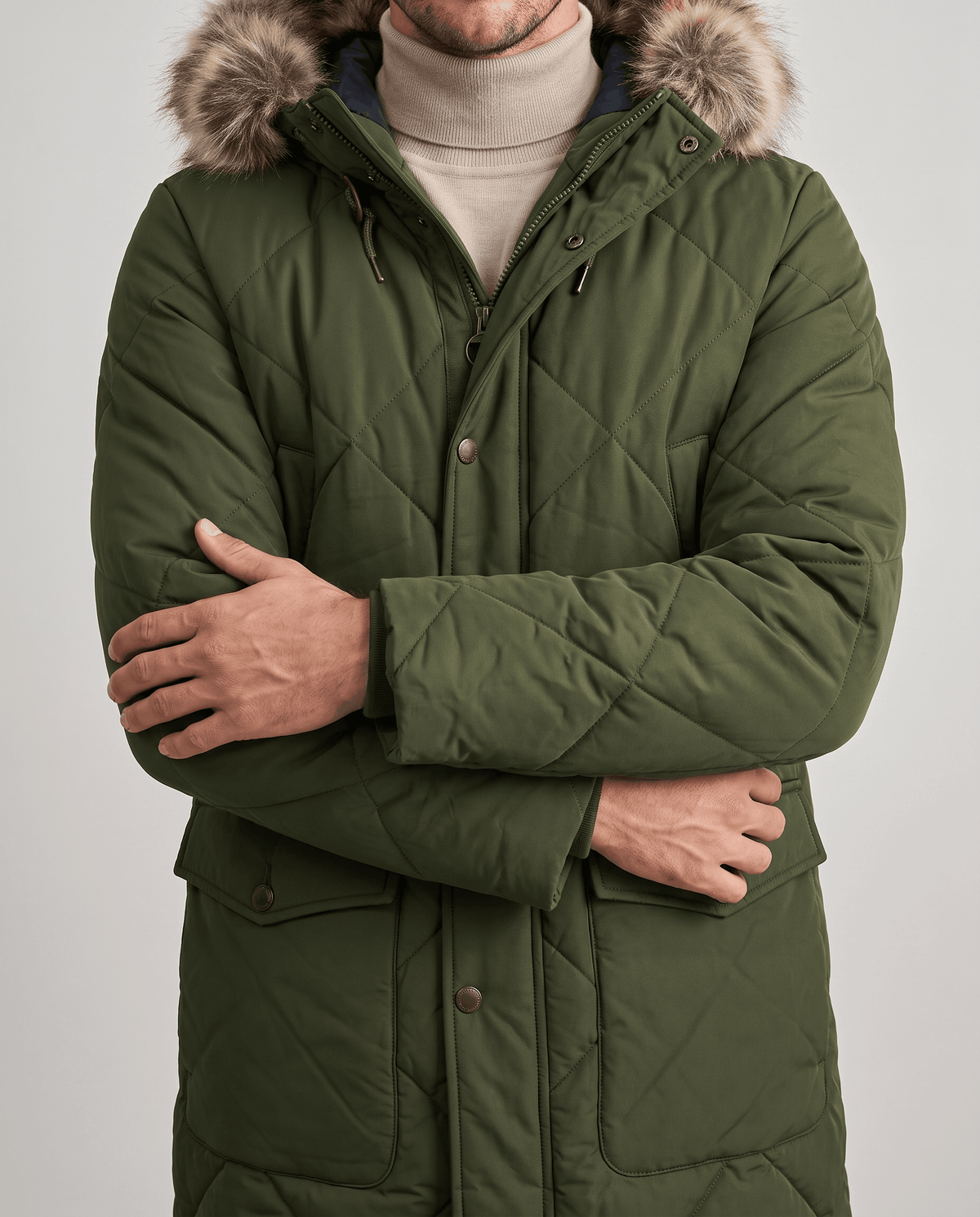 Men's army green quilted long parka, front close-up showing flap pockets