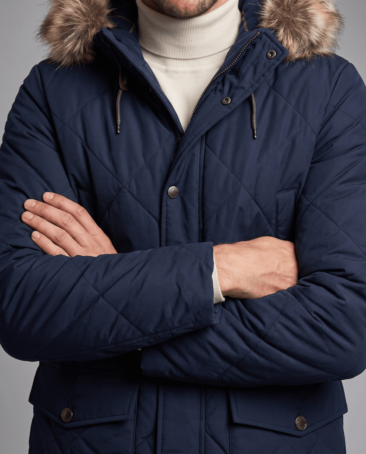 Men's navy blue quilted long parka, front close-up