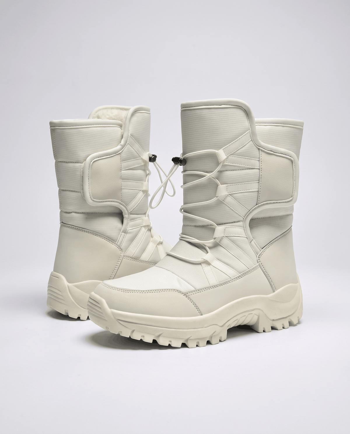 Pair of beige quilted boots angled to show cord tops and thick soles