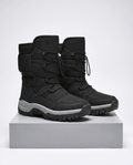 Black quilted winter boots with drawstring tops and gray sole stripes on a plinth