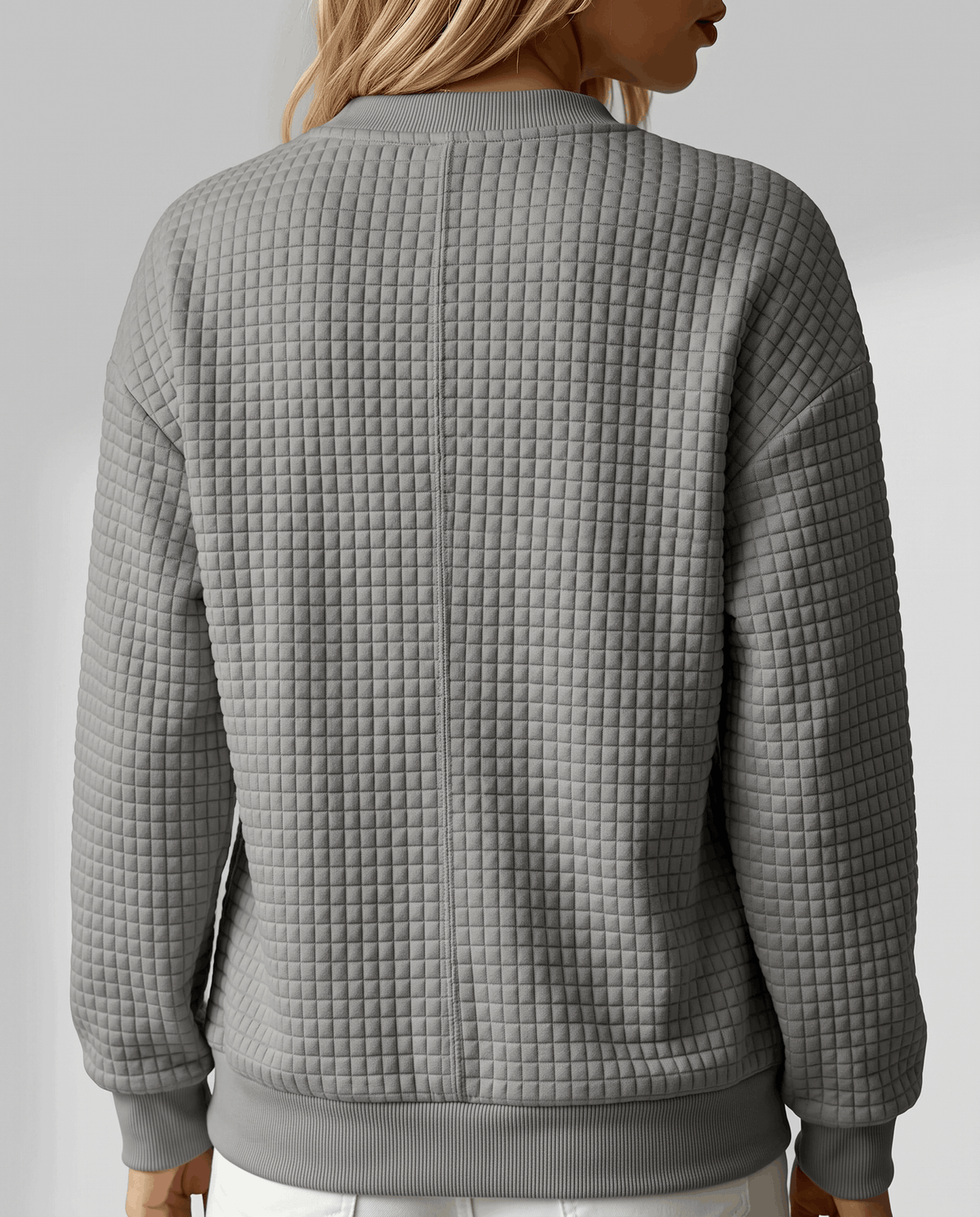 Back view of heather gray pullover showing grid texture and ribbed hem