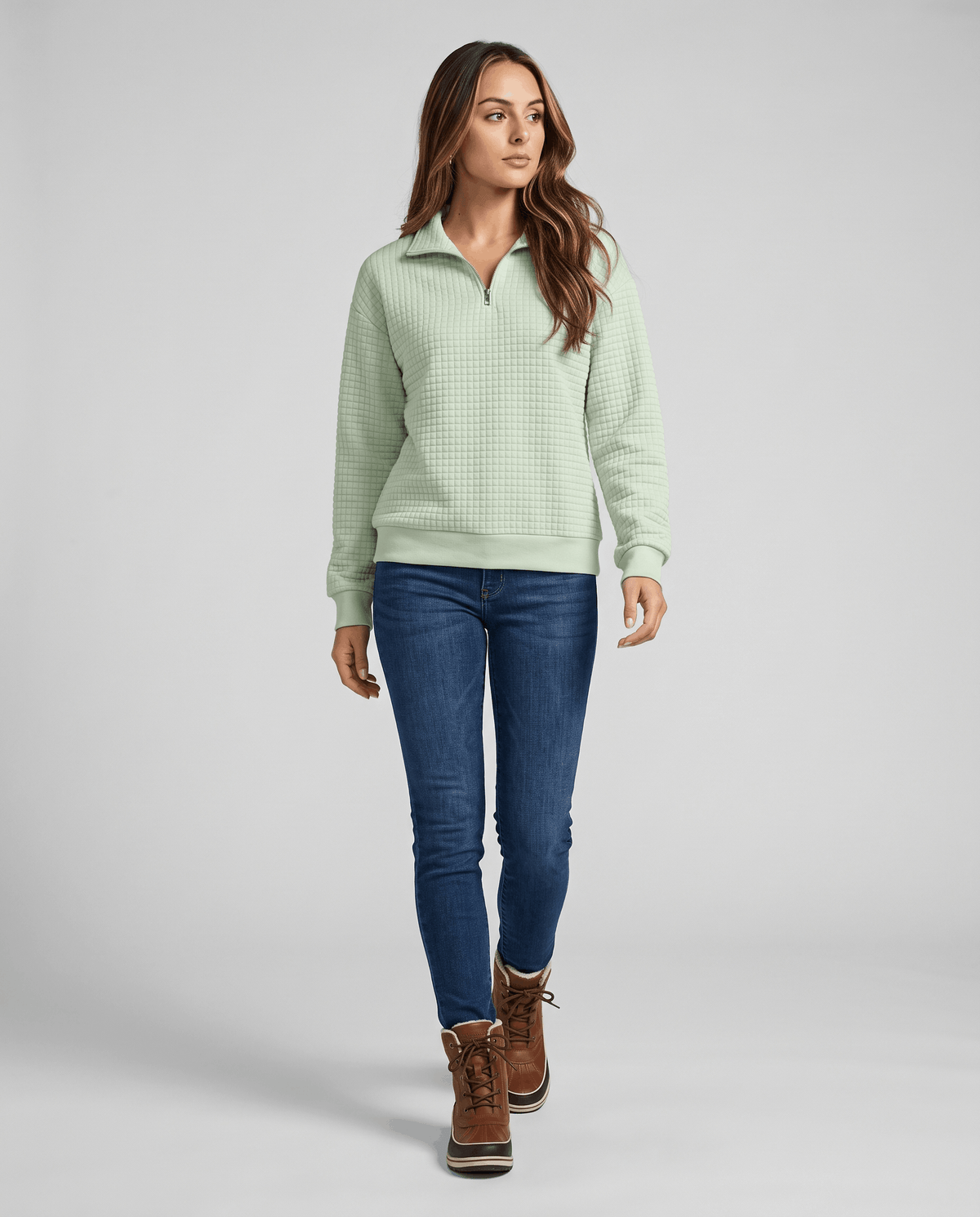 Full-length view of mint green pullover with jeans and brown ankle boots