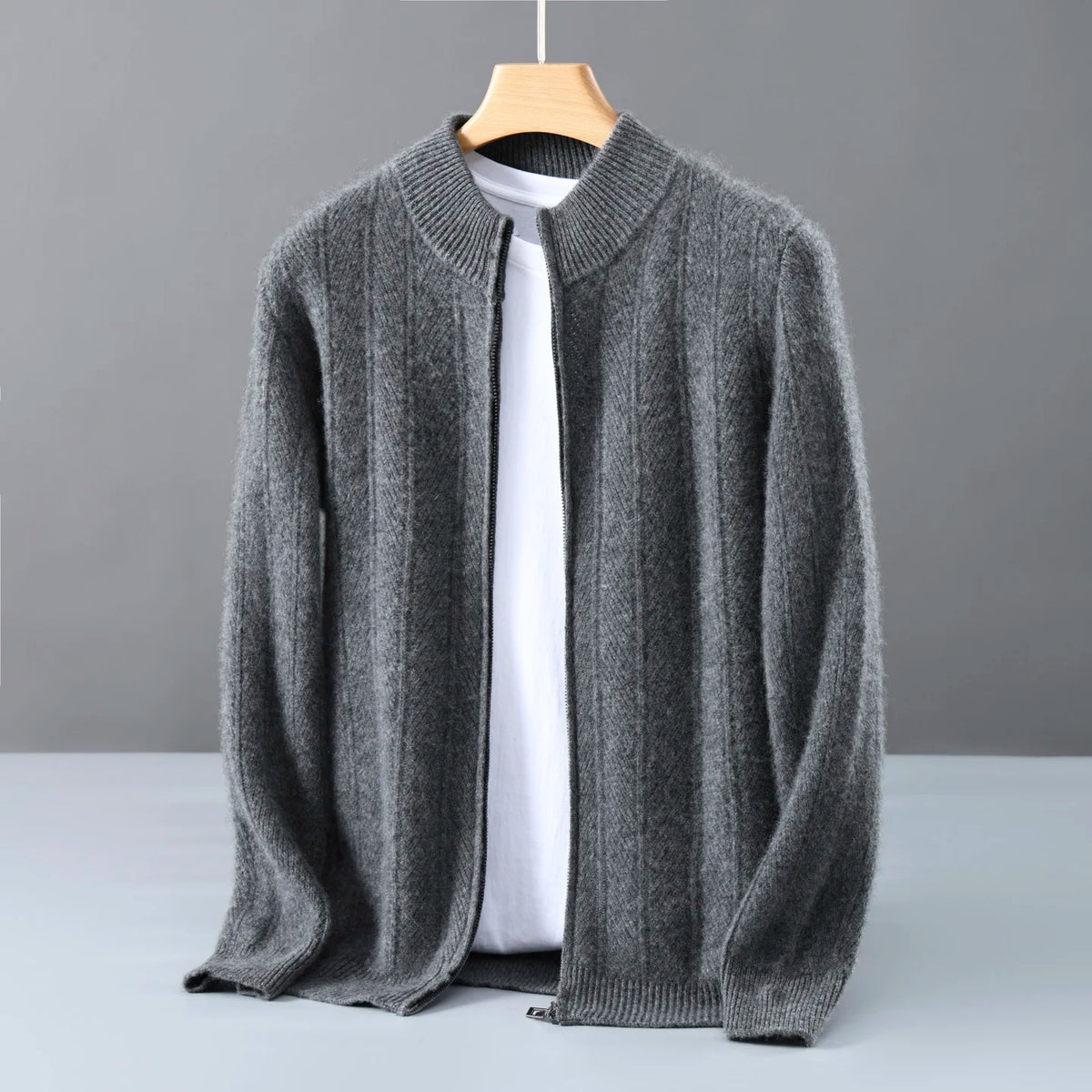 Gray ribbed zip cardigan hanging open on a wooden hanger