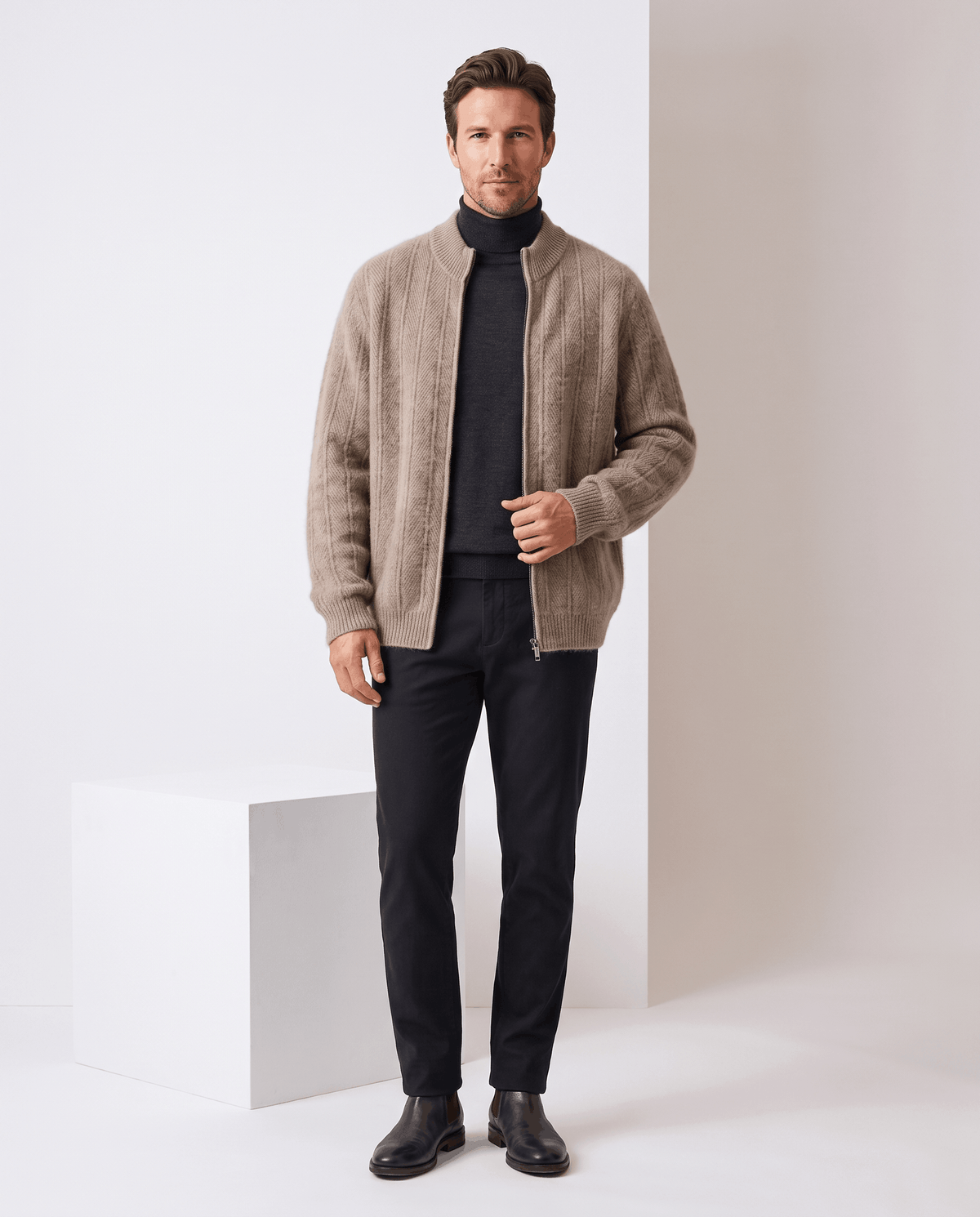 Full-length view of the taupe cardigan over a black turtleneck with black jeans