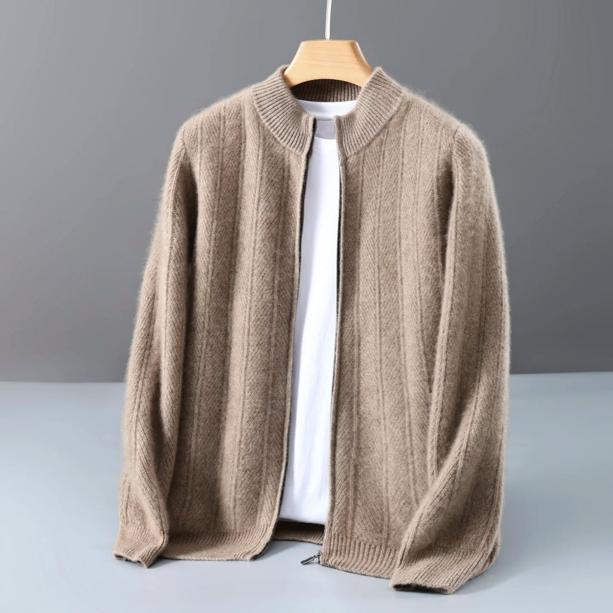 Taupe ribbed zip cardigan hanging open on a wooden hanger