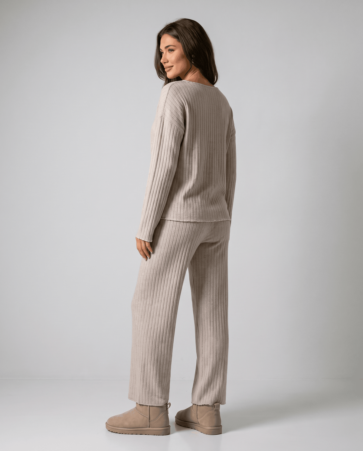 Back view of the beige ribbed knit top and wide-leg pants