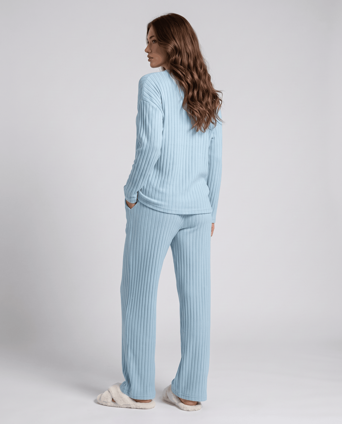 Back view of the light blue ribbed knit top and wide-leg pants