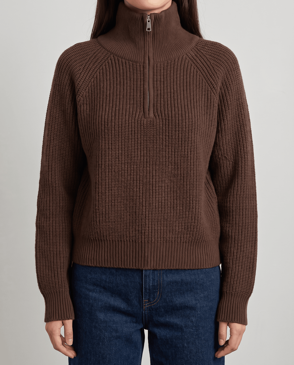 Close-up of brown sweater with the spread collar zipped up