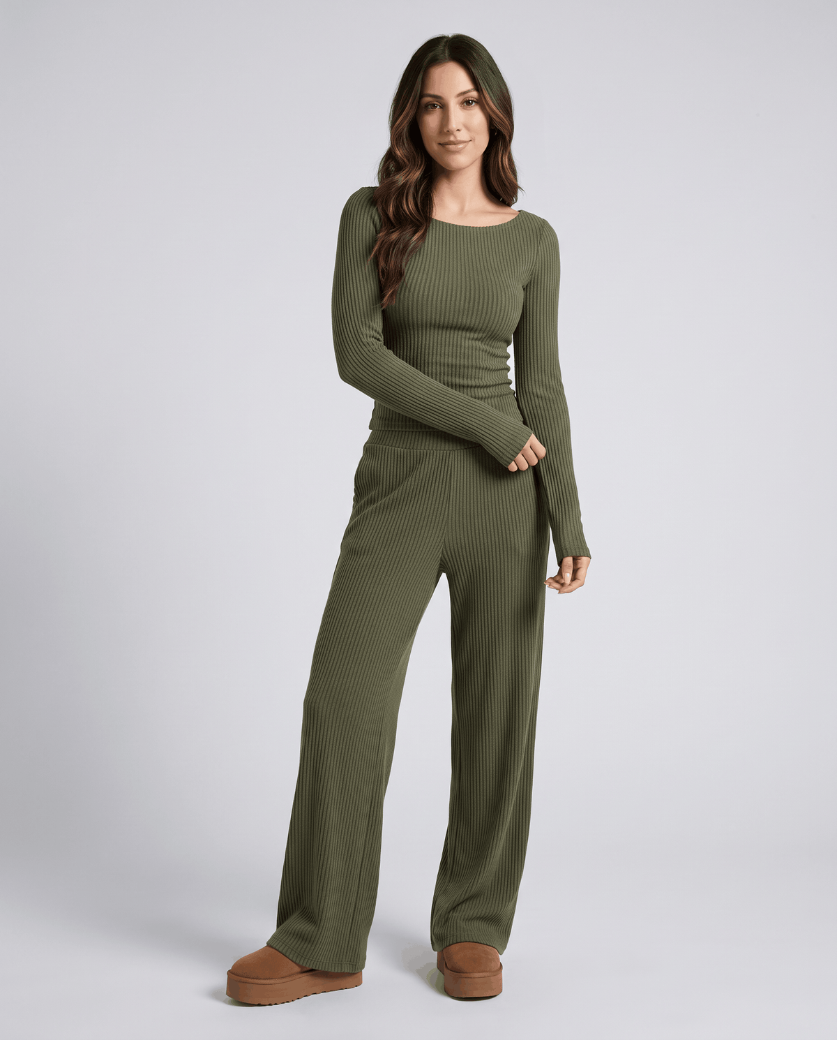 Green ribbed long-sleeve top and wide-leg pants worn with brown shoes, full-length front view
