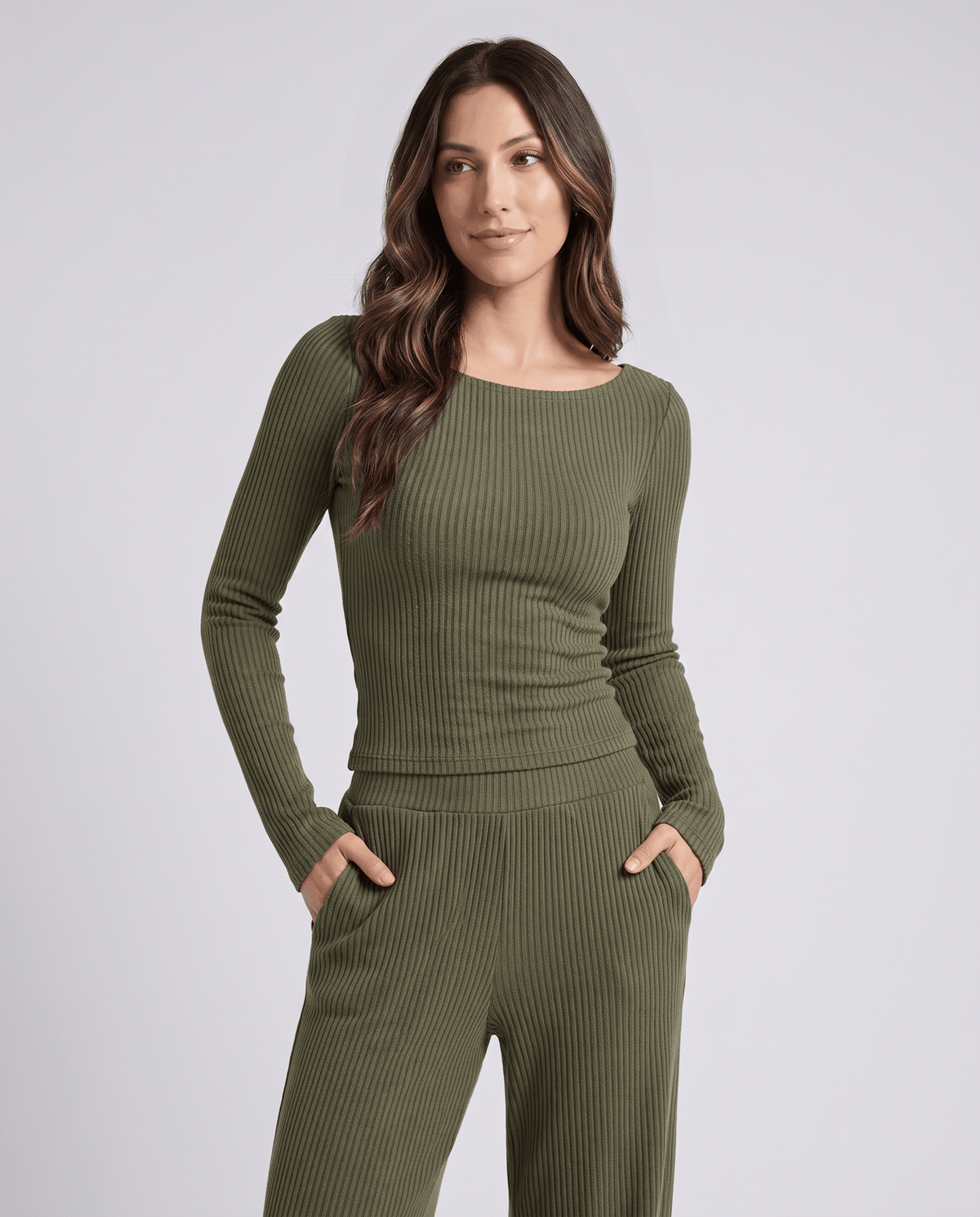 Green ribbed top and wide-leg pants with both hands in the pockets, front view
