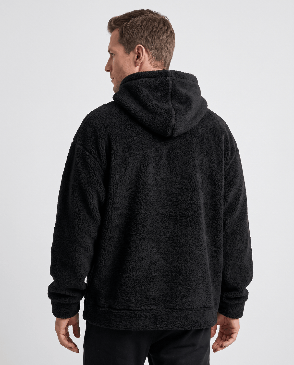 Back view of the black oversized hoodie with dropped shoulders