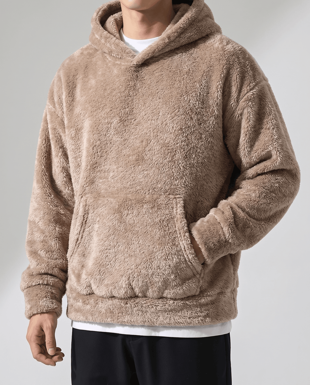 Front view of the brown plush hoodie with kangaroo pocket over a white tee